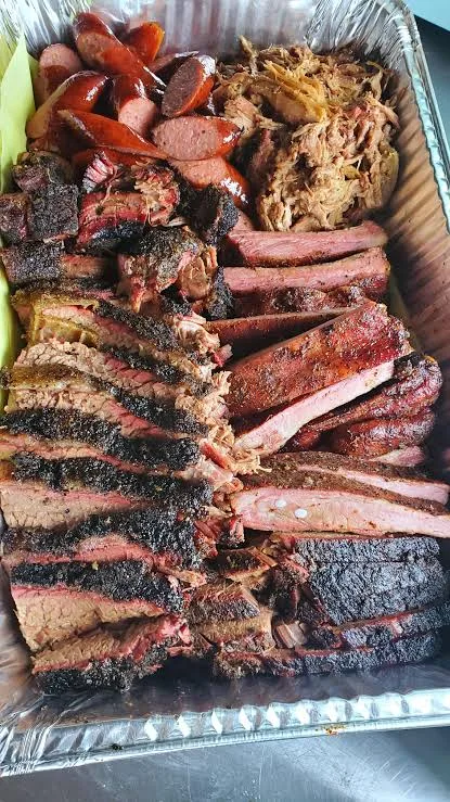 Sliced smoked brisket fresh from the smoker